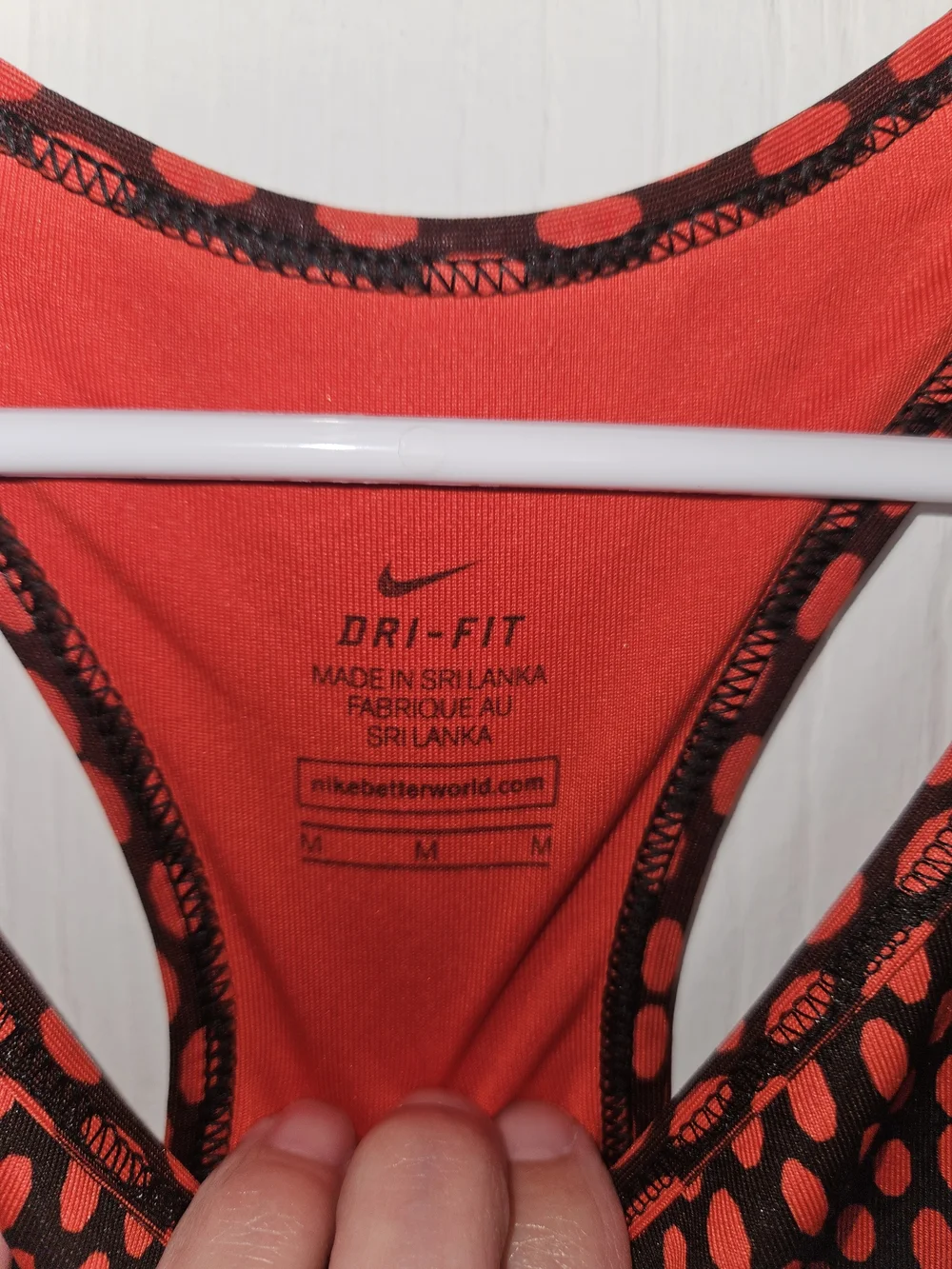 Nike Women's Red and Black Dotted Racerback Sports Bra